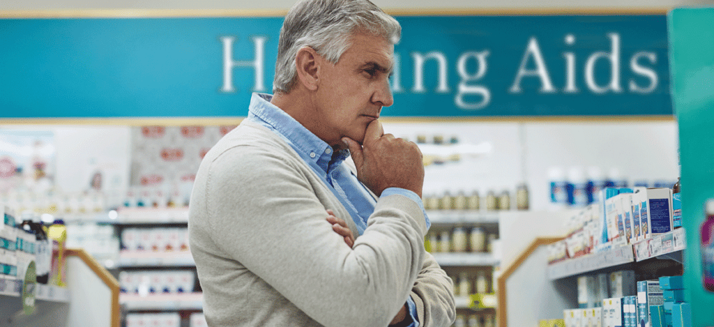 Man looking at over the counter hearing aids